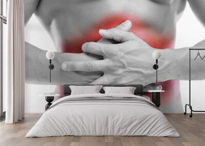 Man with stomach pain touching the abdomen, isolated on white Wall mural