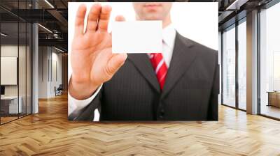 young business man holding blank business card, isolated on whit Wall mural