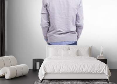 Young guy standing from back on white background Wall mural