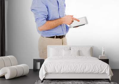 young man full body using a tablet computer against white backgr Wall mural