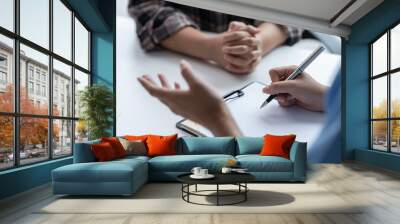 Asian female doctor using a stethoscope to examine a patient, ask for information, give advice, comfort, plan a course of treatment and preventive care. concept of health check Wall mural