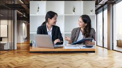 Business idea creative brainstorming sessions for projects Strategic topic of two Asian girls working together data analysis Happy clarification of various financial information at the desk. Wall mural