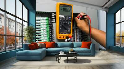 Digital multimeter checking voltage Wall mural