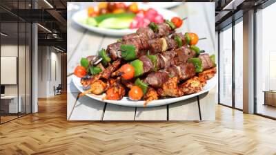 Assorted delicious grilled meat with vegetableы on white plate  Wall mural