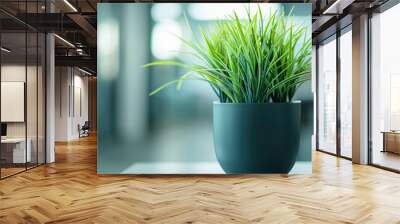 Office potted plant with blurred background depicts nature in work environment Wall mural