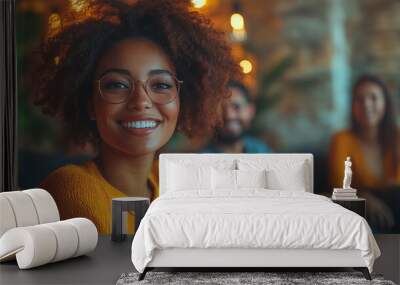 Smiling woman with curly hair and glasses in yellow sweater. Concept of happiness and diversity Wall mural