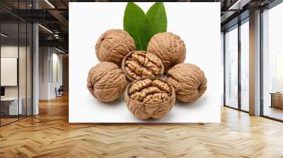 Six walnuts with their shells intact and two walnuts with their shells opened are arranged in a circle on a white background, with a green leaf in the center Wall mural