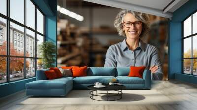 cheerful mature female architect in hardhat  Wall mural