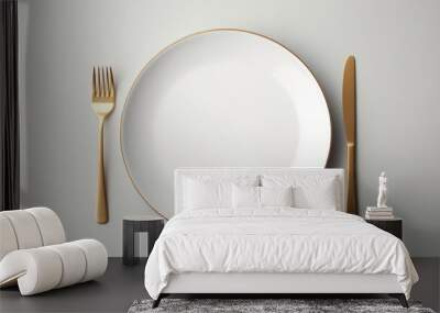 details on the dining table,top view of empty plate and gold cutlery on gray background Wall mural