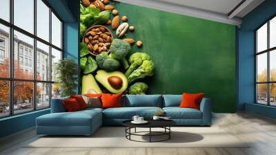 Fresh vegetables, fruits, and nuts, vegetarian vegetables, Colorful vegetables on green background Wall mural