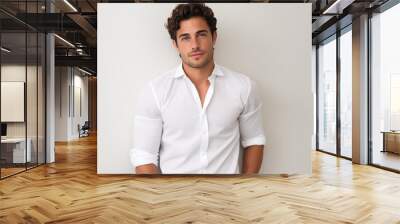 Handsome adult male against a plain white backdrop.  Wall mural