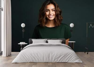 Portrait of funny young lady dressed casual t-shirt smiling on dark green background. Wall mural