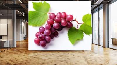 Red grapes with green leaves and half sliced  on white background.  Wall mural