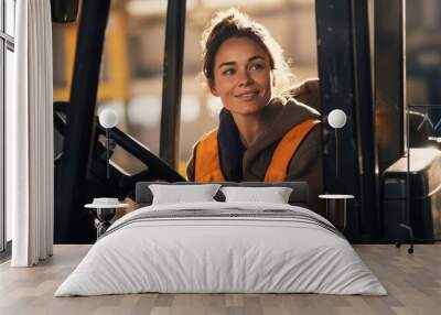 smiling young female worker driving forklift  Wall mural