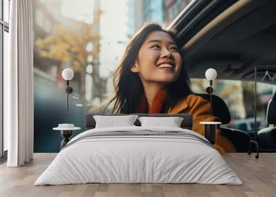 Young beautiful asian women getting new car. she very happy and excited looking outside  Wall mural