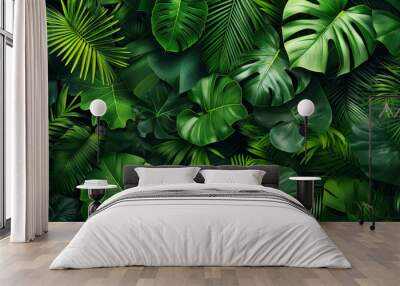 A lush green jungle with many leaves and vines Wall mural