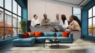 Business people having meeting in office Wall mural