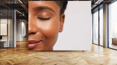 Close-up of smiling woman with eyes closed Wall mural