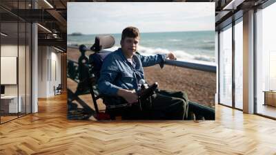 Portrait of disabled teenage boy by the sea Wall mural