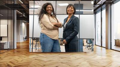 Portrait of smiling businesswomen in office Wall mural