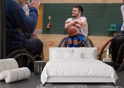 Team of wheelchair basketball players having practice Wall mural