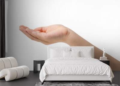 Child hand with palm up in a white isolated background Wall mural