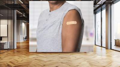 Vaccine and man with plaster on arm, medical shoulder injection dose and immunization bandage. Corona virus immunity, immune system cure or wellness and male patient healthcare vaccination. Wall mural