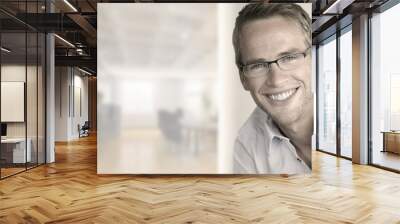 great looking young man with perfect smile in trendy glasses Wall mural