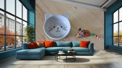 Bol, gamelle en forme de chat, accessoire et jeu pour chat sur fond bois, pour animal de compagnie. Wall mural