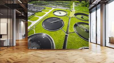 Sewage farm. Static aerial photo looking down onto the clarifying tanks and green grass. Geometric background texture. Wall mural