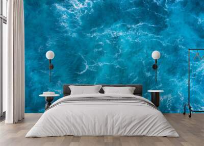 Top view of blue frothy sea surface. Shot in the open sea from above. Wall mural