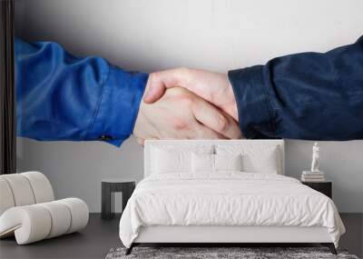 Close-up of workers handshake standing for a trusted partnership  Wall mural