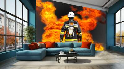 Fire fighter on oil and gas industry, successful firefighter at work , Fire suit for fighter with fire and suit for protect fire fighter, Security team when fire case. Wall mural