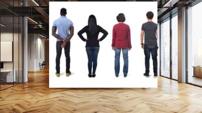  rear view of large group of men and women wearing  jeans and standing on white background Wall mural