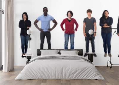 front view of a group of men and women wearing jeans on white background Wall mural