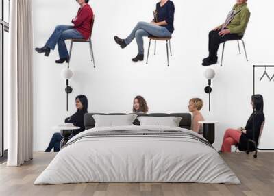 group of women sitting on chair on white background, side view Wall mural