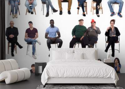 large group of mixed people siiting on chair on white Wall mural