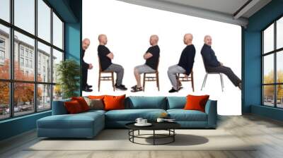 line of same man view in various outfits sitting on white background, side view Wall mural