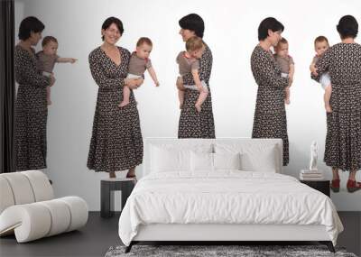 same mother carrying her baby various poses standing and walking on white background Wall mural