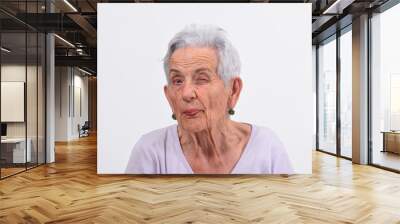 senior woman wink the eye on white background Wall mural