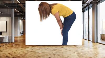 side view of full portrait of a woman looking for something on the ground Wall mural