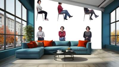 woman with various types of clothes sitting  on white background Wall mural