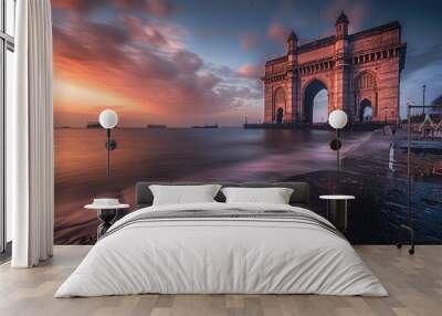 Mumbai. The stone arch of India's Gateway shines at sunrise with the Arabian Sea in view Wall mural