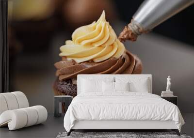 A cupcake with chocolate frosting and a yellow swirl Wall mural