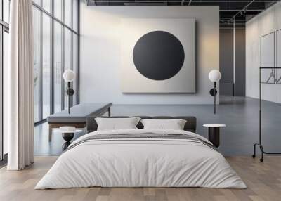 A large black and white painting of a circle is on the wall of a room Wall mural