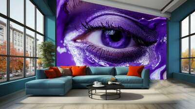 A woman's eye is painted purple with glitter Wall mural