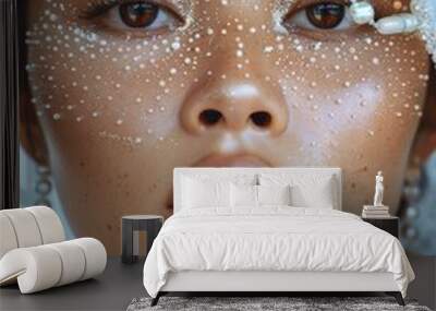 A woman with a face covered in glitter and pearls Wall mural