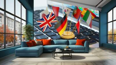 Global communication and business concept, translate and e-learning, national flags of the world countries on computer laptop keyboard Wall mural