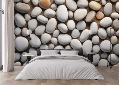 A close-up view displays a variety of small, smooth white pebbles arranged on a natural stone surface, showcasing intricate textures and natural lighting for a crisp appearance SEAMLESS PATTERN Wall mural