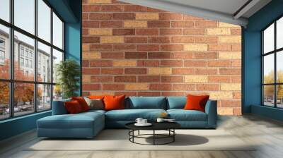 Full frame texture background of an attractive modern brick wall with textured bricks in varying shades of brown and beige, having a spotted appearance, with faint shadows from low angle sunlight Wall mural